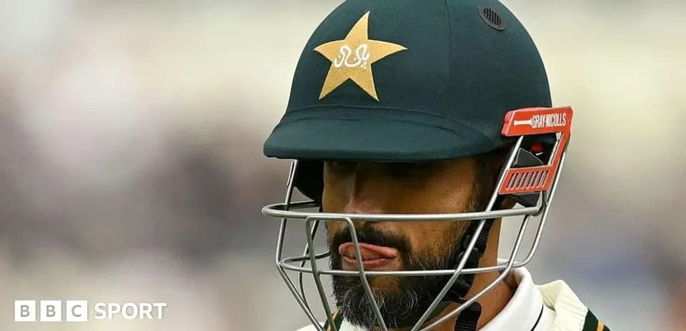 Cricketer wearing helmet during match preparation