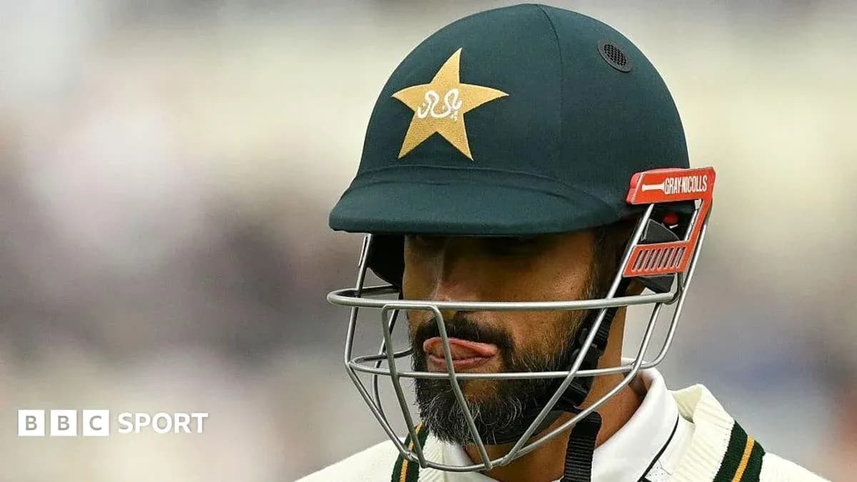 Cricketer wearing helmet during match preparation