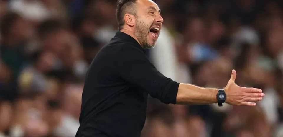 Coach gesturing passionately during a match