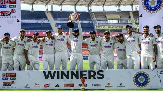 Indian cricket team celebrating victory with trophy
