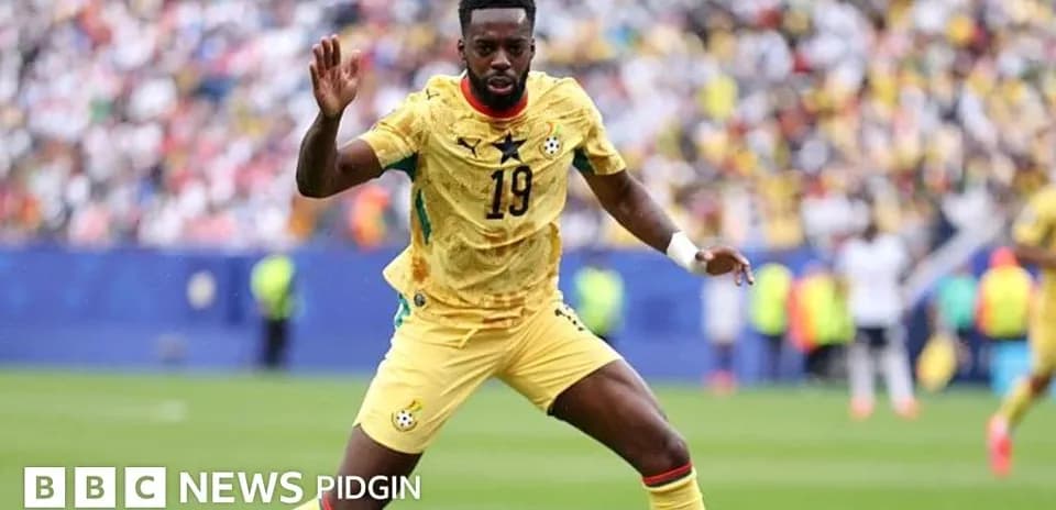 Ghana player in yellow kit during match action