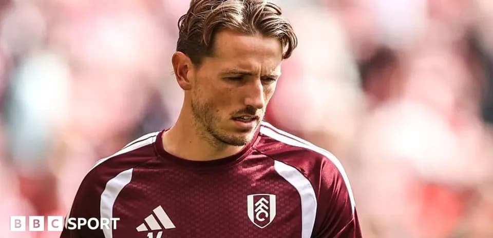 Player wearing Fulham kit during warm-up session
