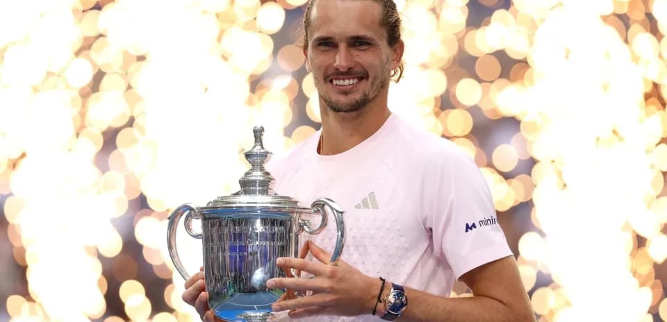 Player holding US Open trophy with fireworks backdrop