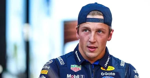 Driver in blue racing suit during event