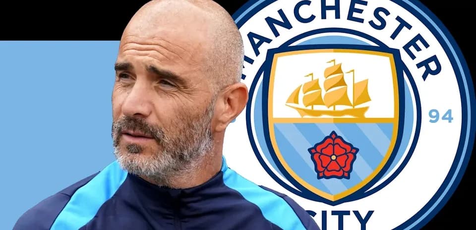 Coach next to Manchester City logo background