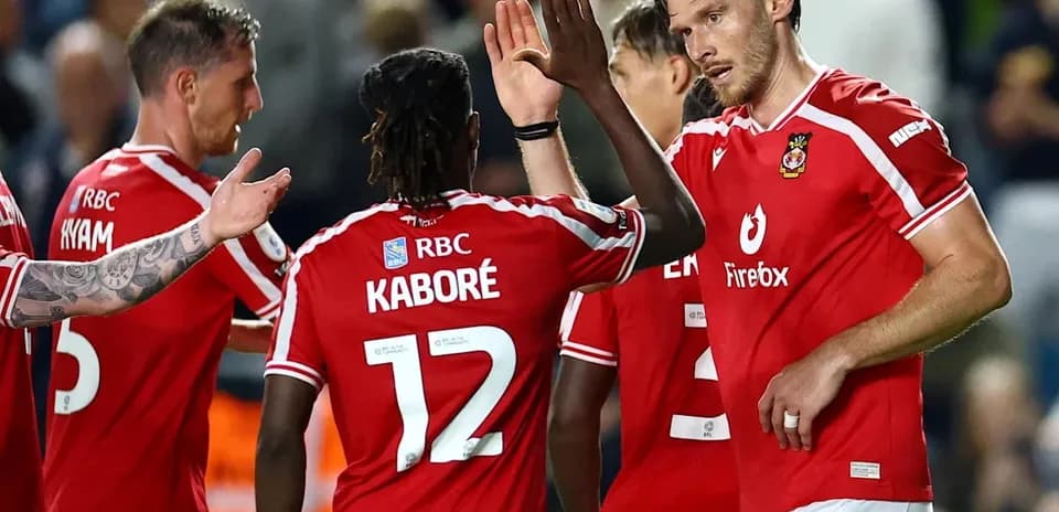 Players celebrating after a goal during match