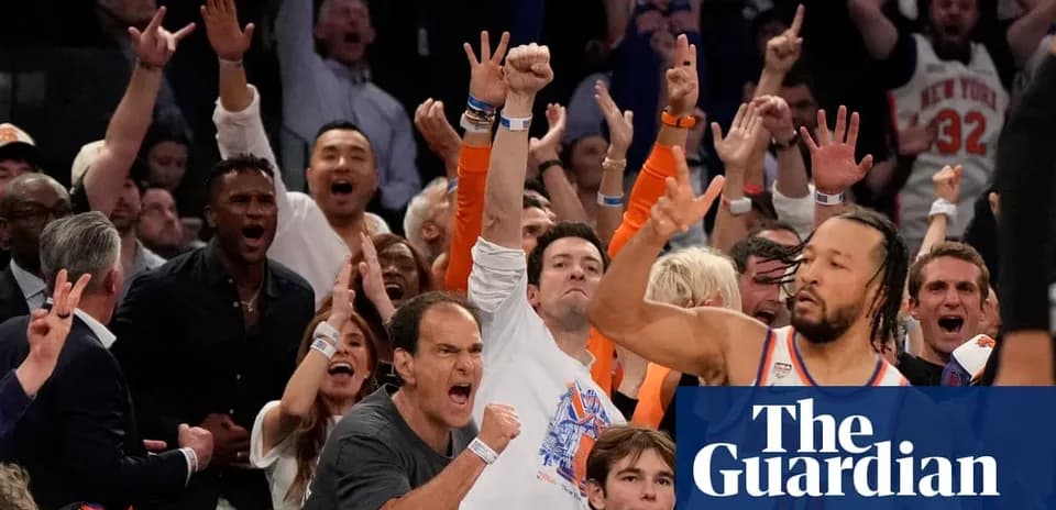 Fans celebrating enthusiastically at a basketball game