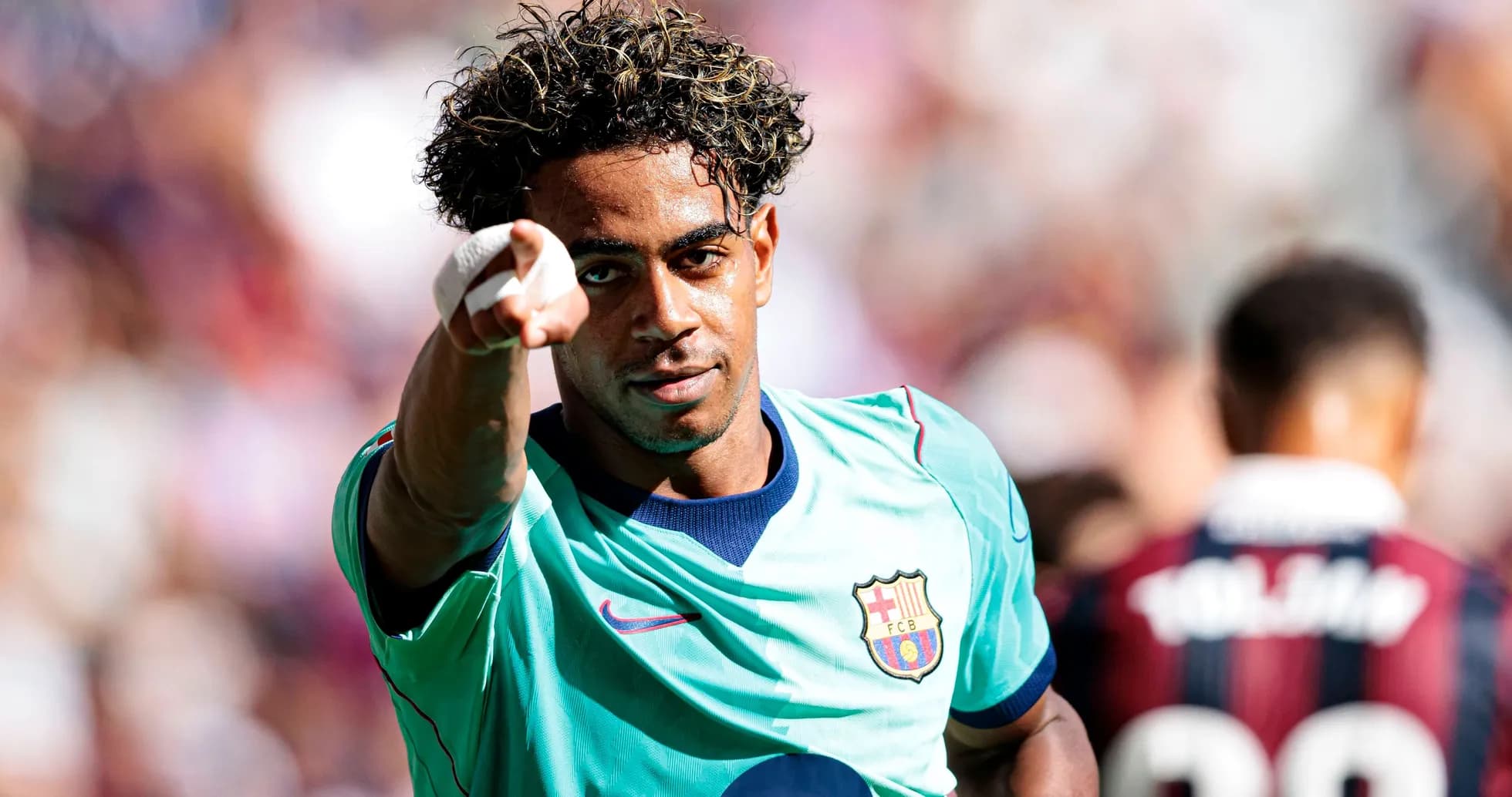 Barcelona player celebrating and pointing during match