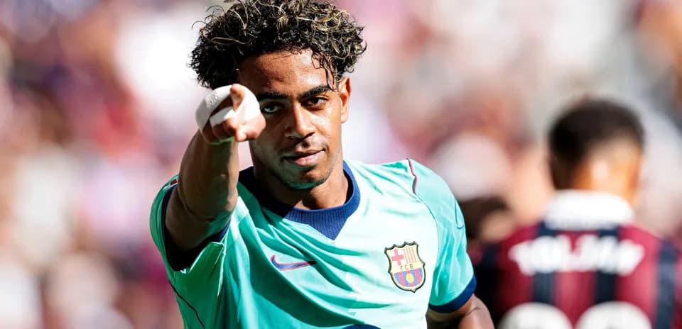 Barcelona player celebrating and pointing during match