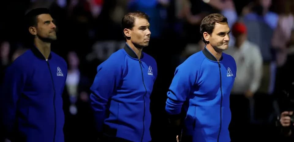 Three tennis players standing together on stage