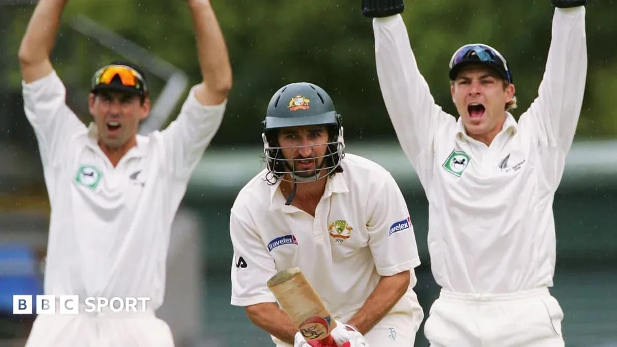 Batsman in action with fielders celebrating appeal