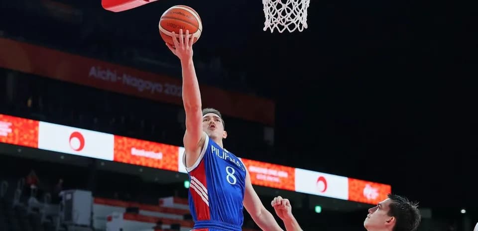 Player shooting a layup during basketball game