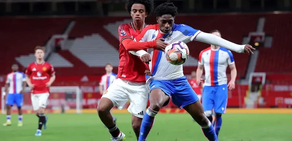 Two players battling for the ball during match
