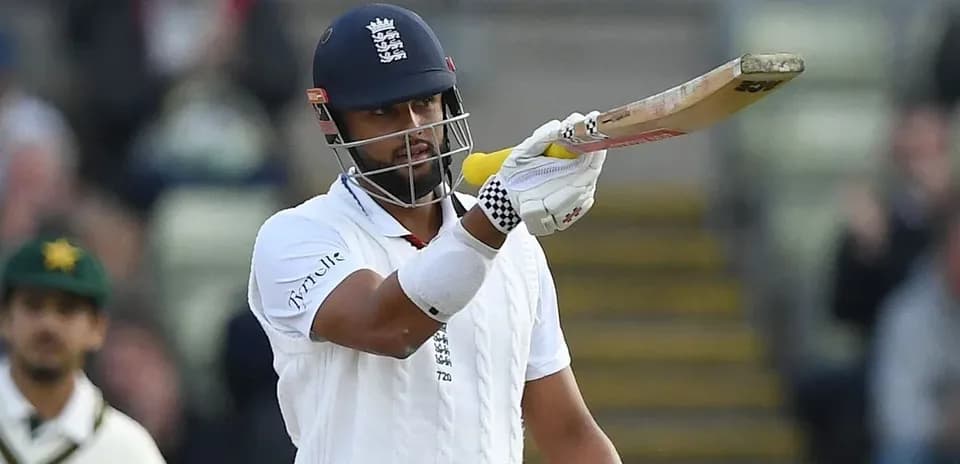 Batsman gesturing with bat during cricket match