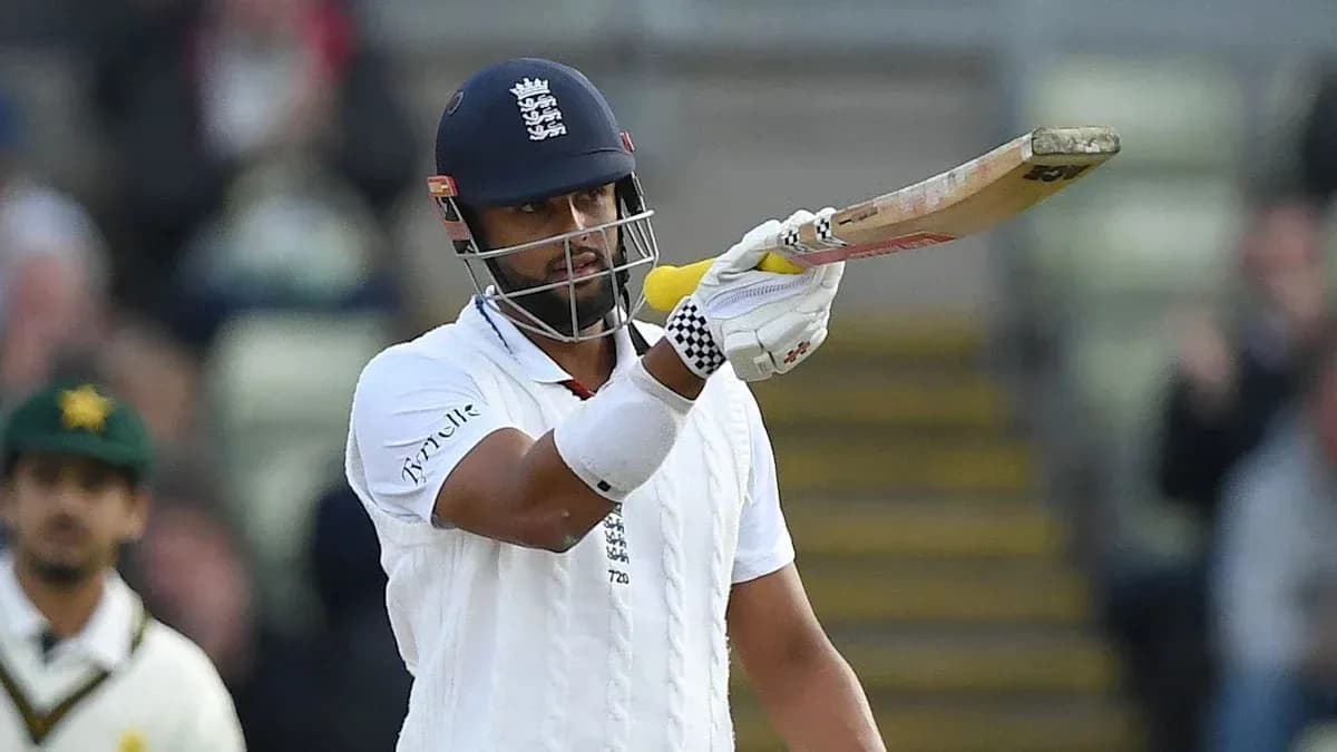 Batsman gesturing with bat during cricket match