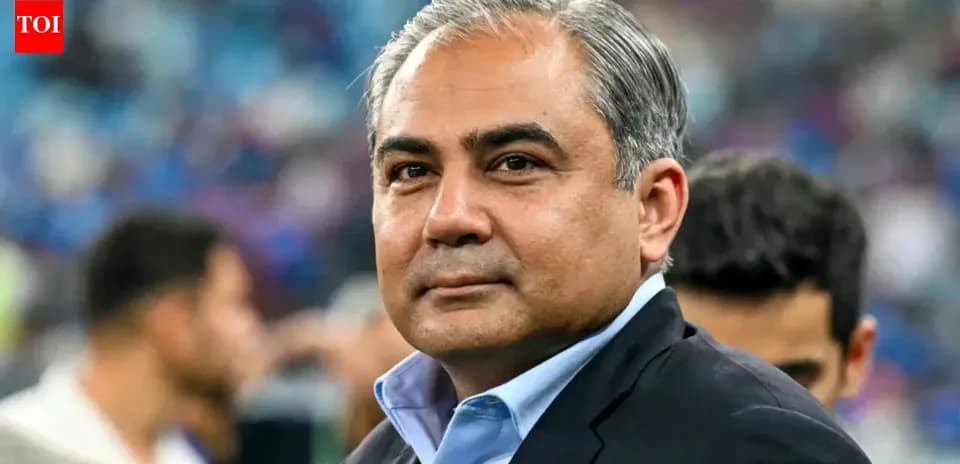 Person in suit at a sports event venue