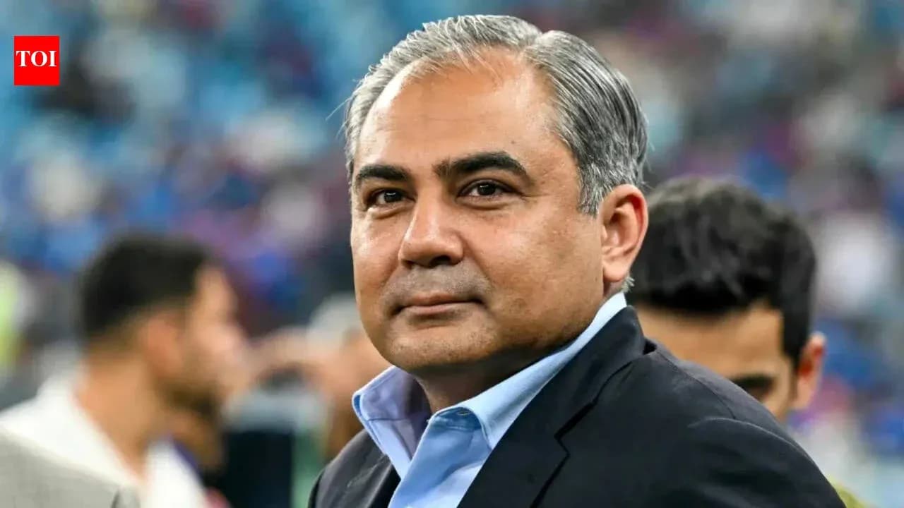 Person in suit at a sports event venue