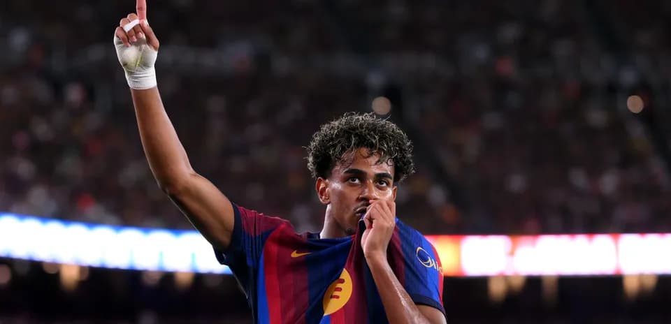 Player celebrating and kissing club jersey during match