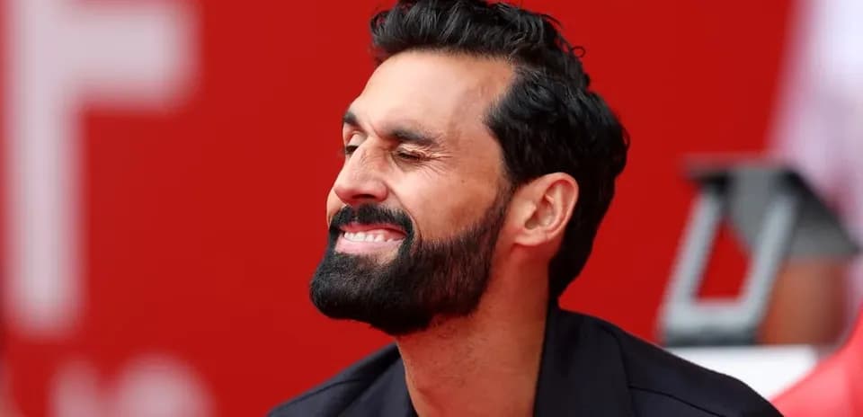 Man smiling while seated on the bench