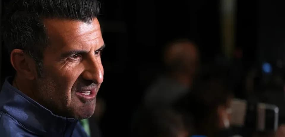 Man speaking at press conference with microphones