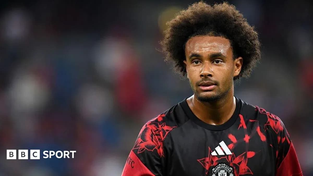 Player in red and black kit on the field