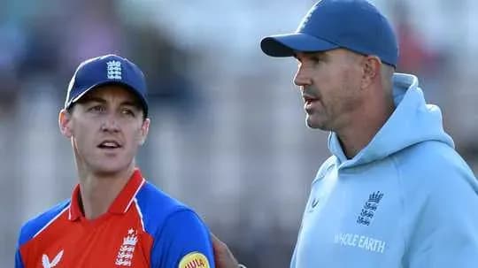 Player and coach discussing strategy during match