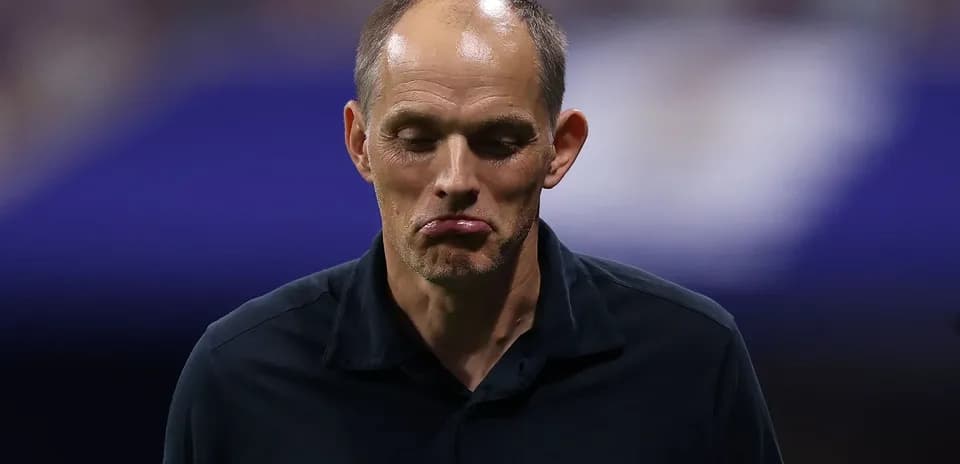Coach walking off with a concerned expression