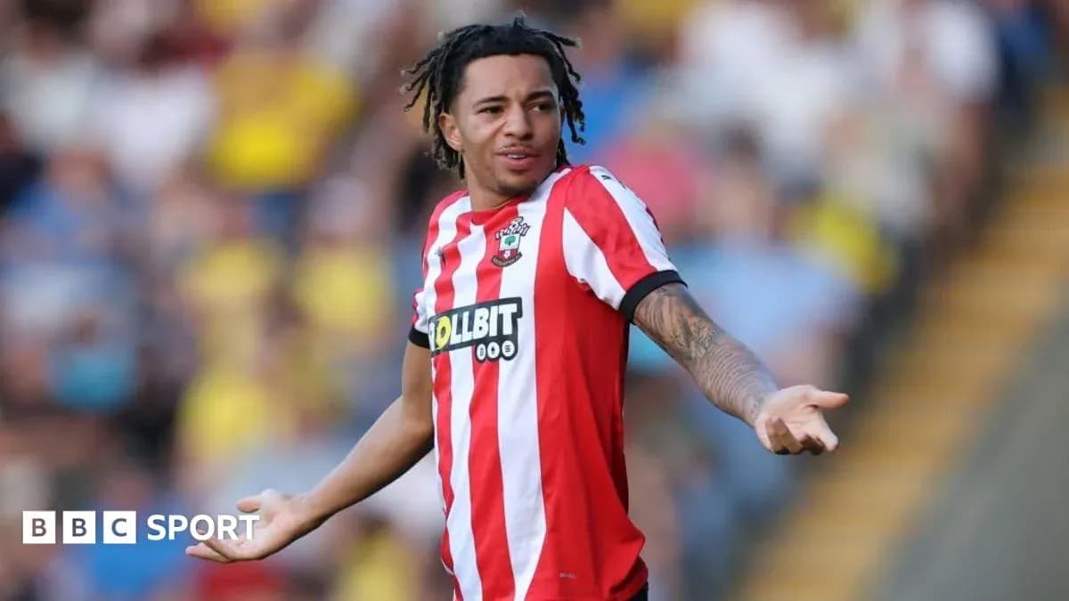 Player gesturing during match in Southampton kit