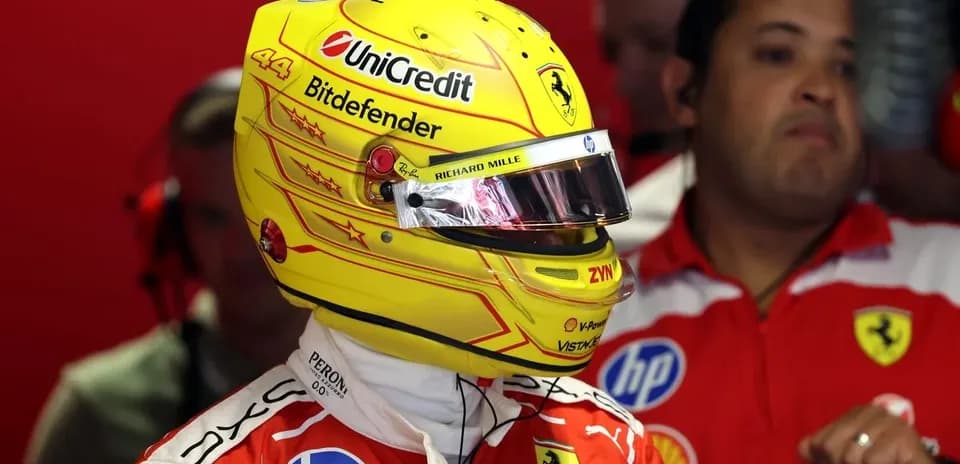 Driver in Ferrari suit preparing for race