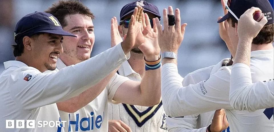 Players celebrating after a successful wicket in cricket