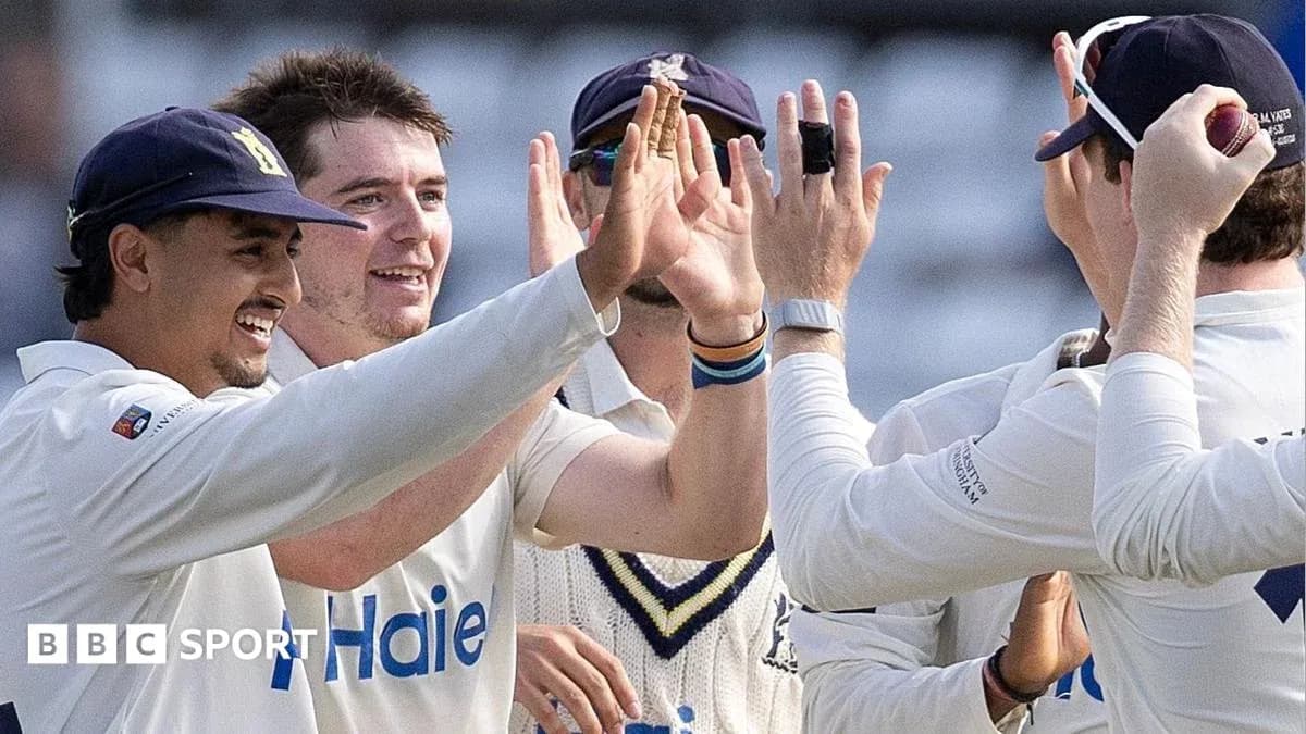 Players celebrating after a successful wicket in cricket