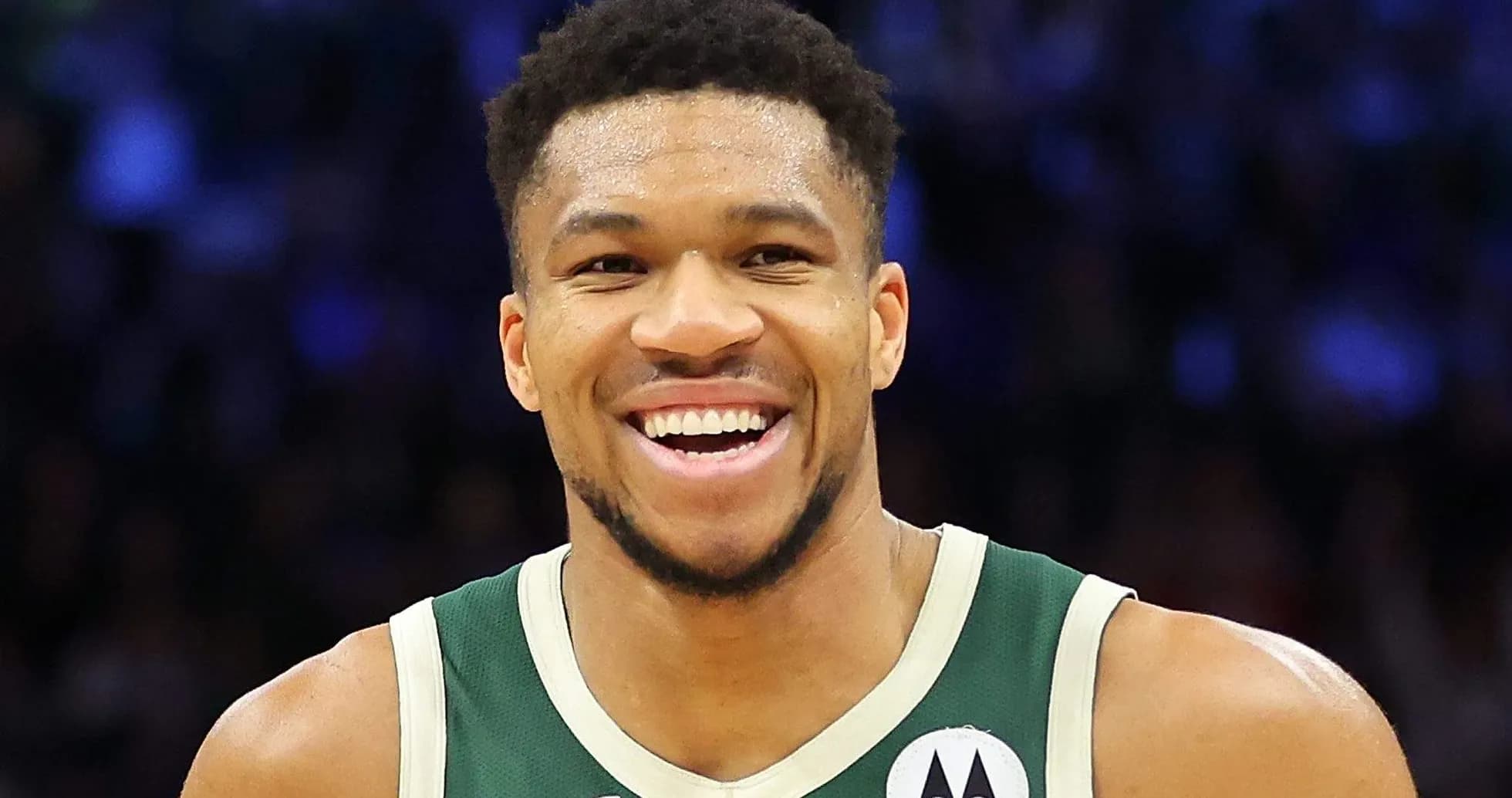 Basketball player smiling in team jersey