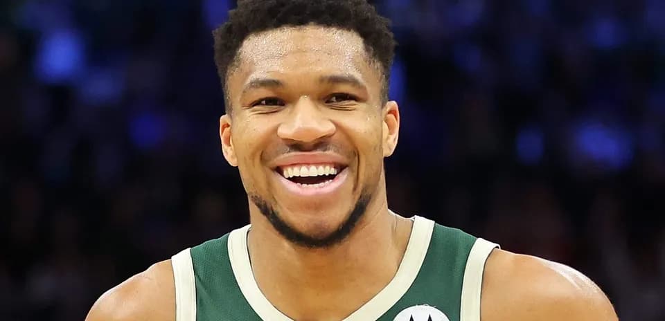 Basketball player smiling in team jersey