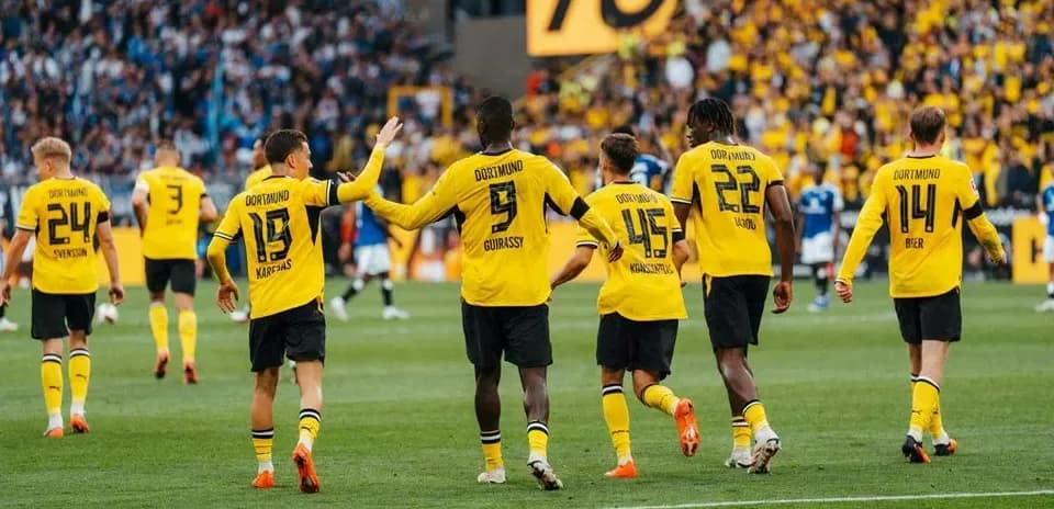 Borussia Dortmund players celebrating a goal on field