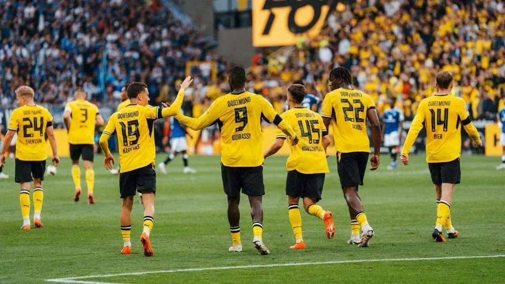 Borussia Dortmund players celebrating a goal on field