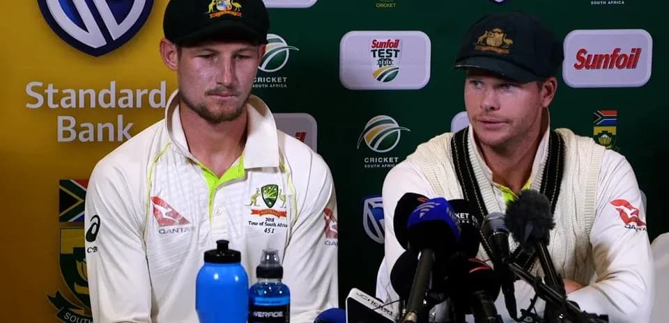 Two Australian cricketers at press conference table