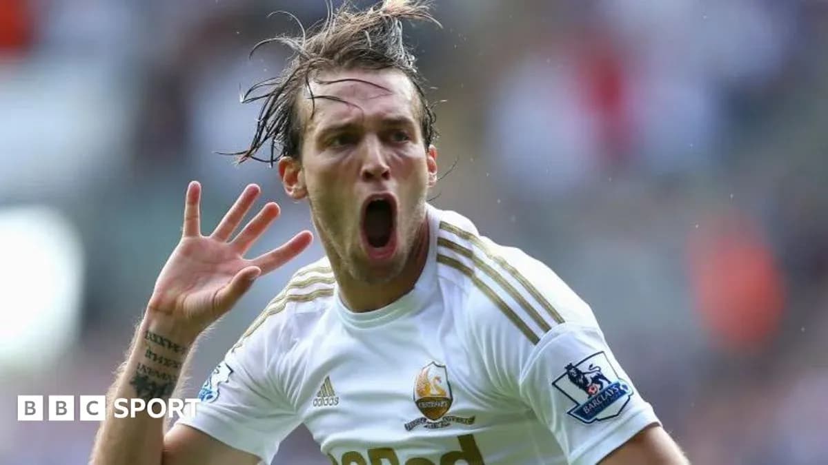 Player celebrating after scoring a goal for Swansea