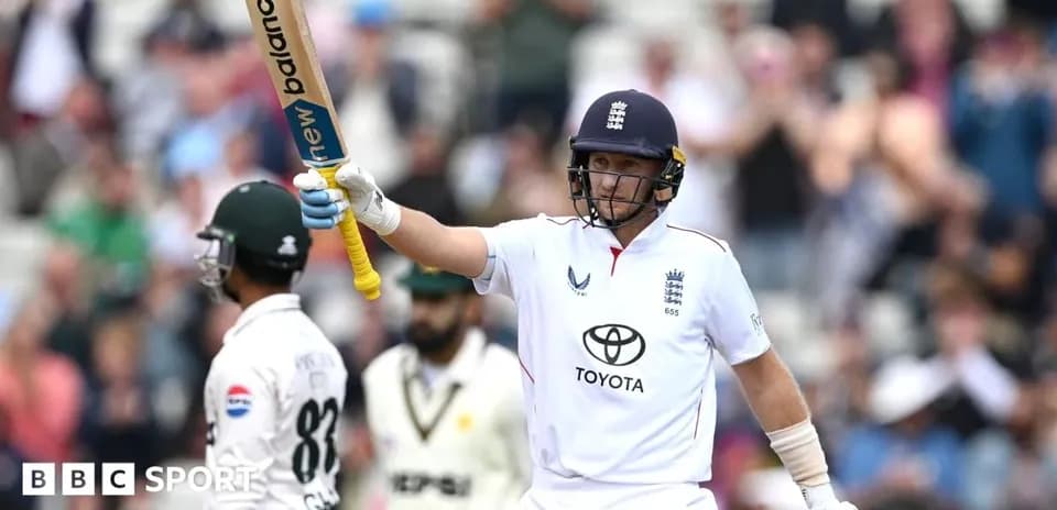 Batsman celebrating with raised bat during match