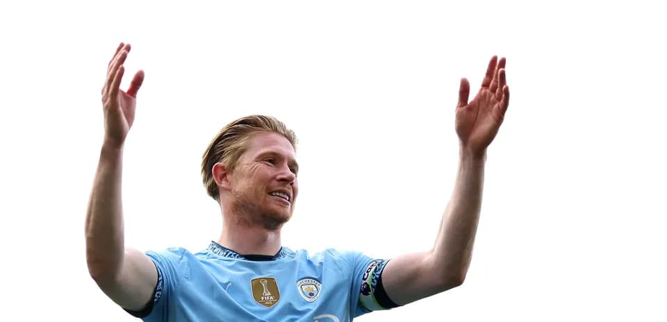 Player celebrating with raised arms on pitch