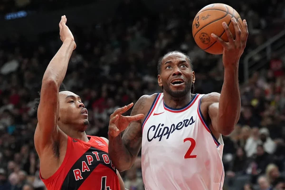 Player shooting the ball while being defended
