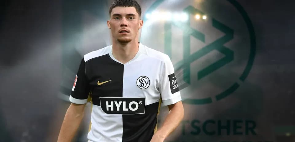 Player in black and white jersey on pitch