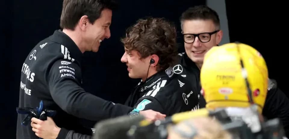 Team members celebrating after a race success