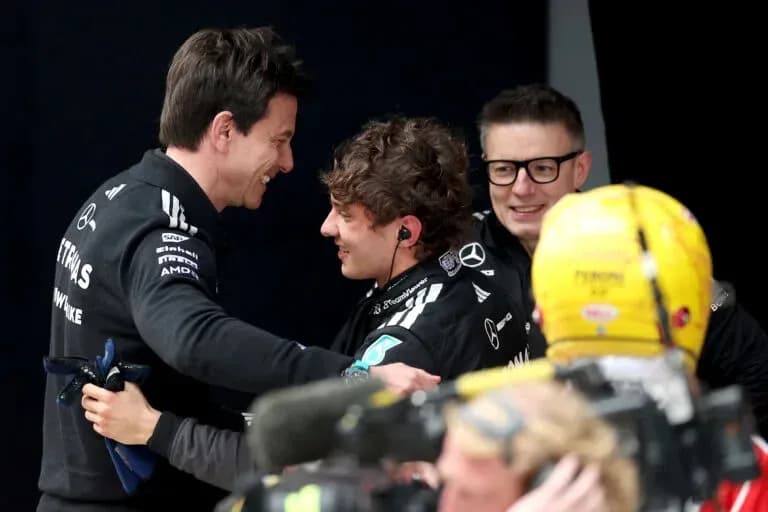 Team members celebrating after a race success
