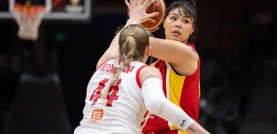 Player passing the ball during basketball game