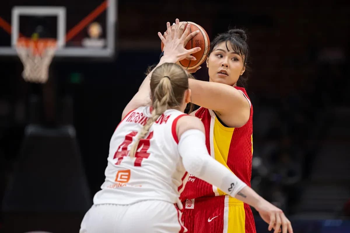 Player passing the ball during basketball game