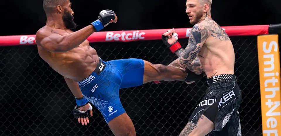 Two fighters engaged in action during UFC match
