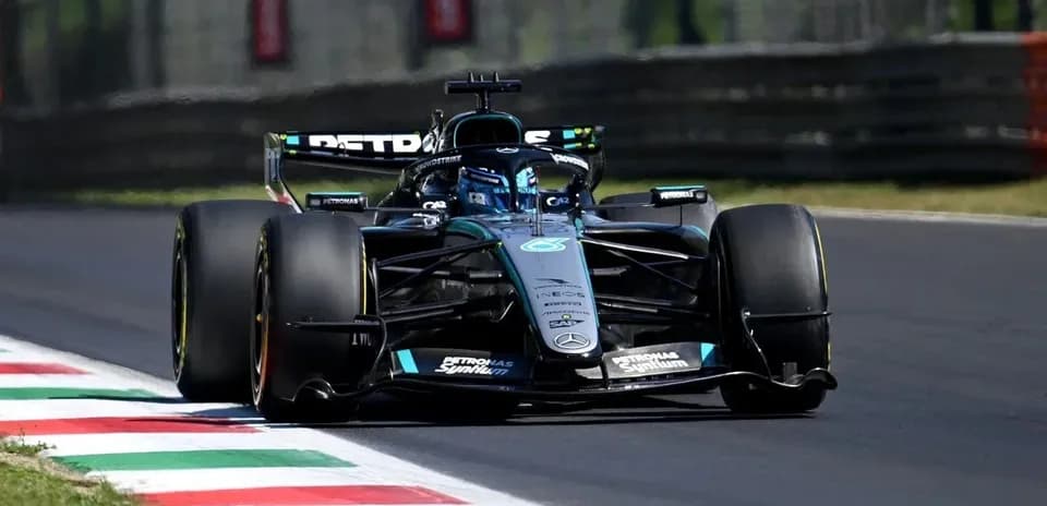 Formula 1 car navigating a turn on the track