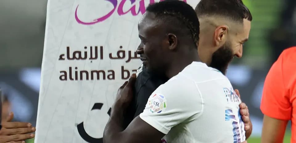 Two players embracing after a match celebration