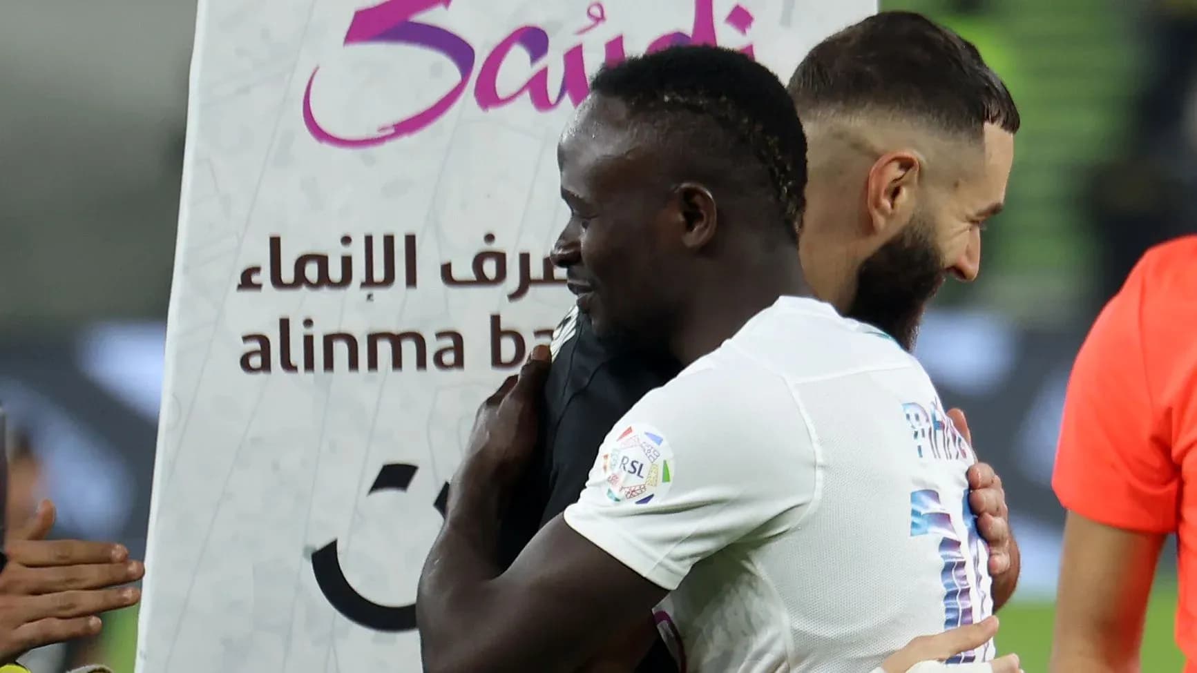 Two players embracing after a match celebration