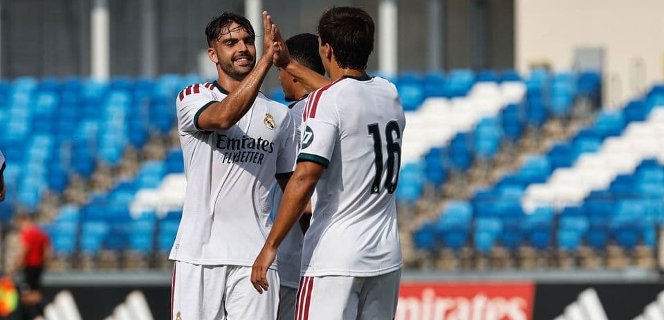 Real Madrid players celebrating a goal on the pitch